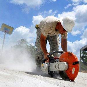 construction worker using saw