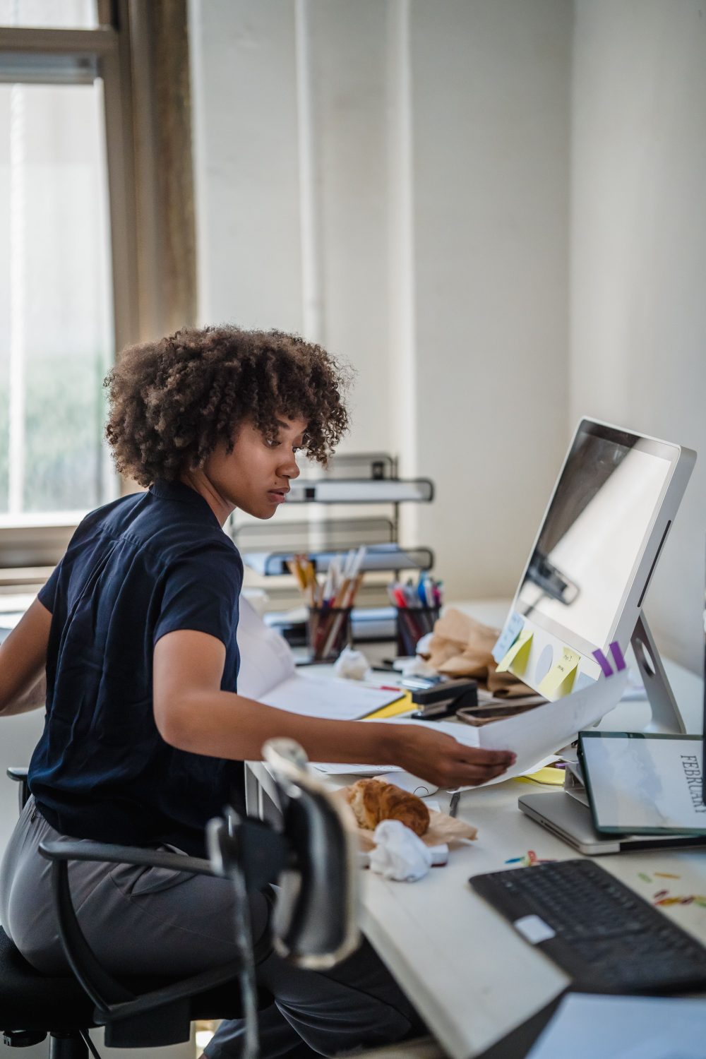A New York employee working at a desk in an office